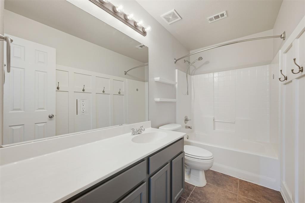 5408 Bridgeport Road McKinney, TX 75071 - Photo 13 of 22 a bathroom with a sink a toilet and shower