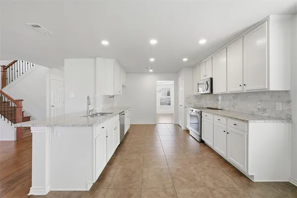 a large kitchen with cabinets