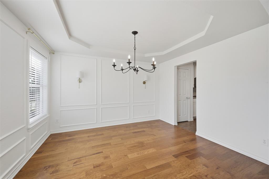 5408 Bridgeport Road McKinney, TX 75071 - Photo 8 of 22 wooden floor in an empty room with a window