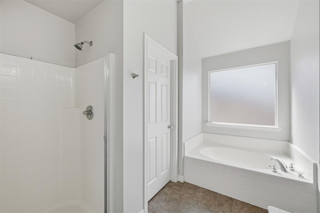 5408 Bridgeport Road McKinney, TX 75071 - Photo 10 of 22 a bathroom with a bathtub shower and a sink