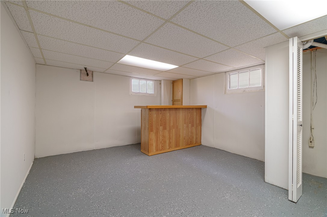 12727 Grannis Road Cleveland, OH 44125 - Photo 36 of 43 Basement featuring plenty of natural light and a paneled ceiling