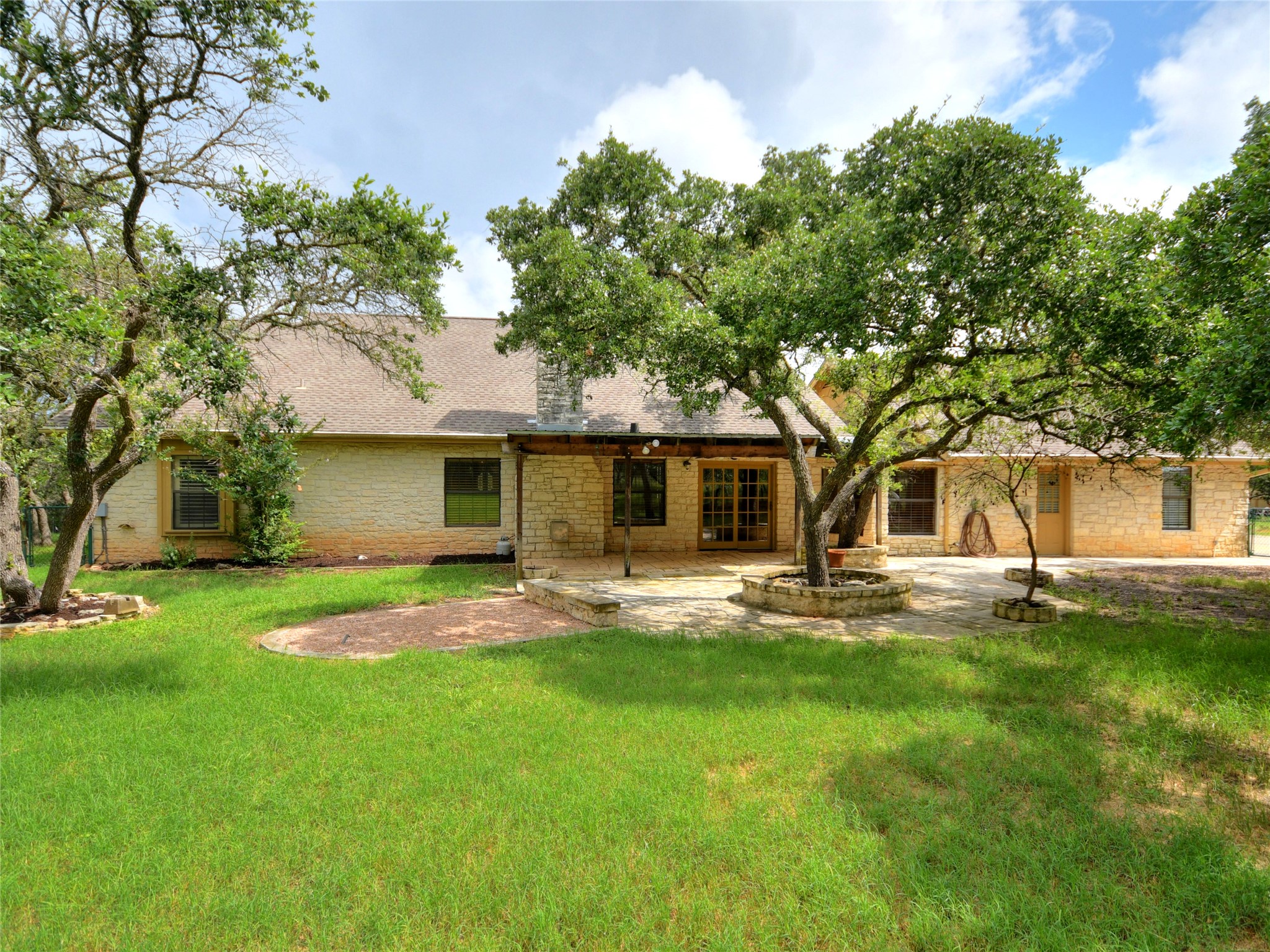 328 Fawnridge Street Georgetown, TX 78628 - Photo 30 of 33 Covered and uncovered back patio, perfect for enjoying the beautiful and peaceful tree covered property.