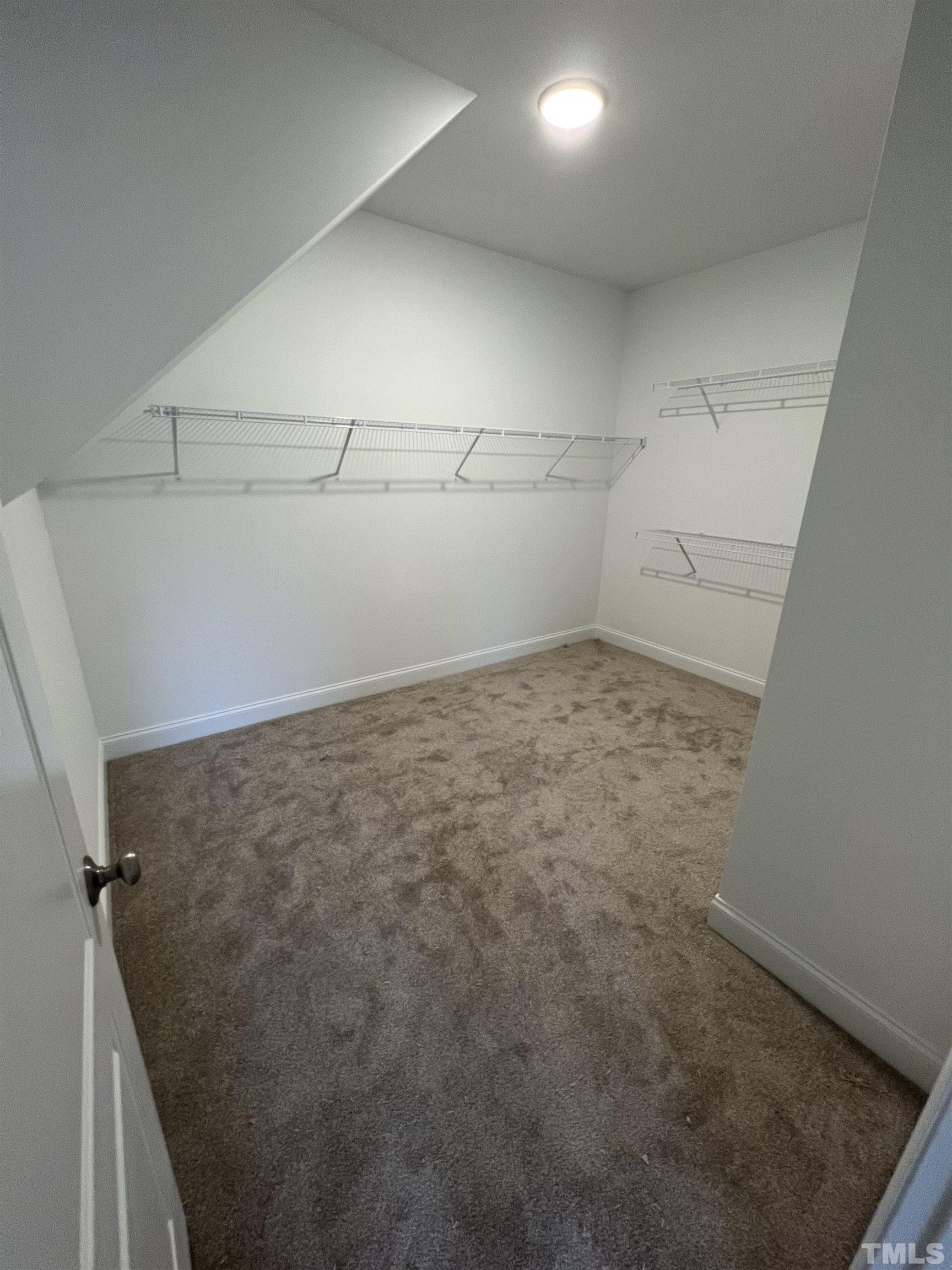 59 Cricket Hill Way Benson, NC 27504 - Photo 14 of 28 a view of a room with racks on the wall