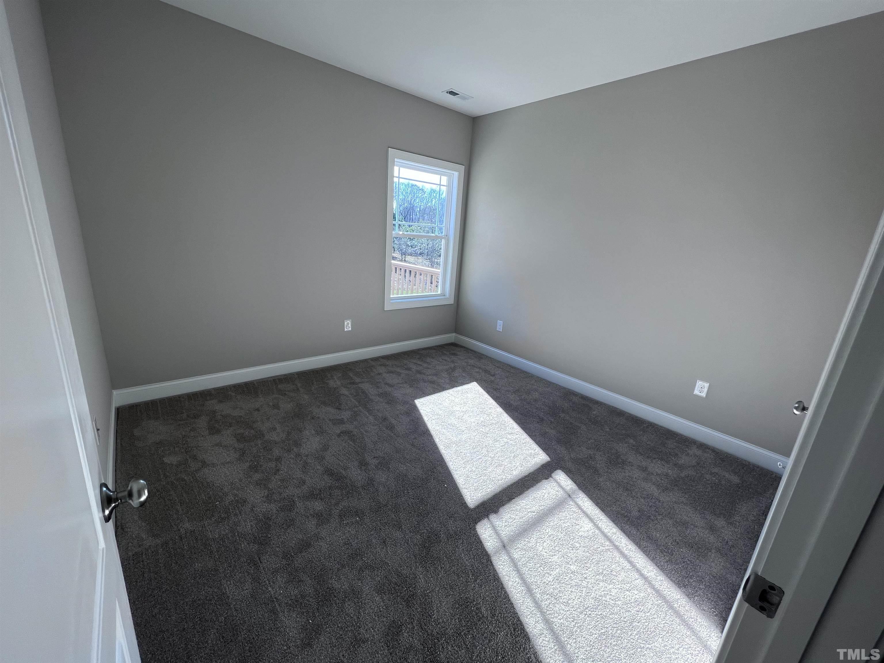 59 Cricket Hill Way Benson, NC 27504 - Photo 18 of 28 an empty room with windows