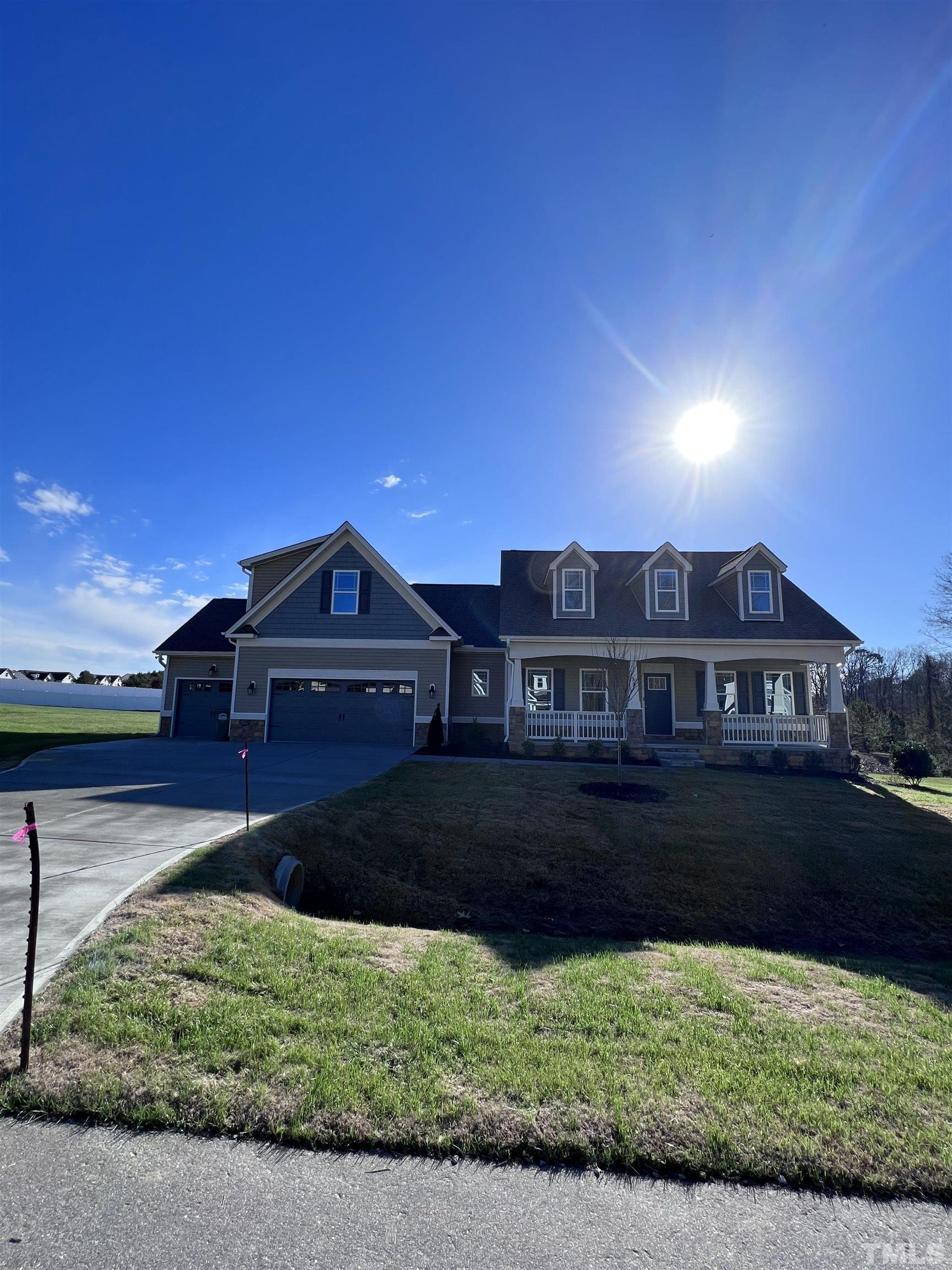 59 Cricket Hill Way Benson, NC 27504 - Photo 2 of 28 a front view of a house with a yard