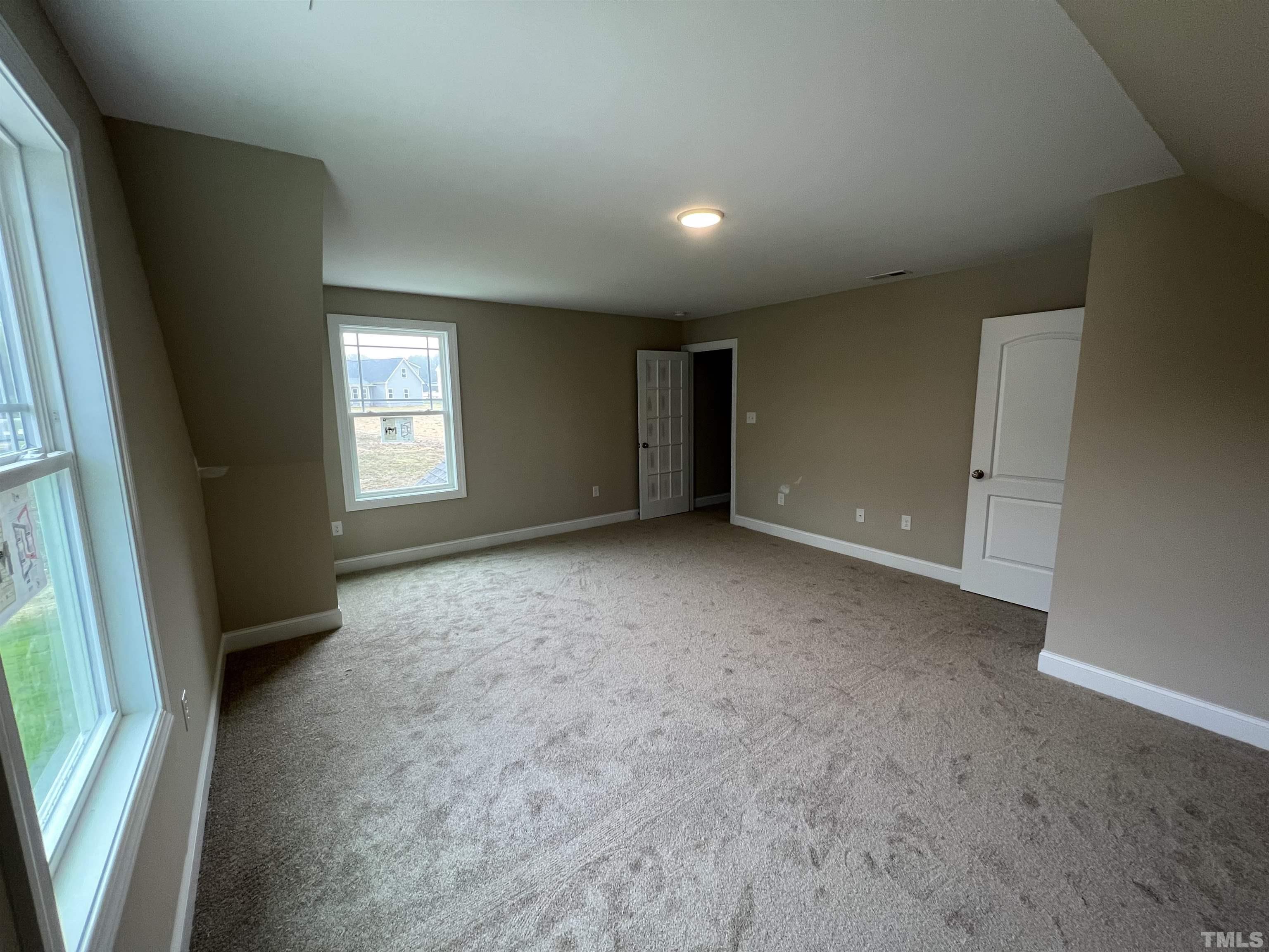 59 Cricket Hill Way Benson, NC 27504 - Photo 24 of 28 an empty room with windows