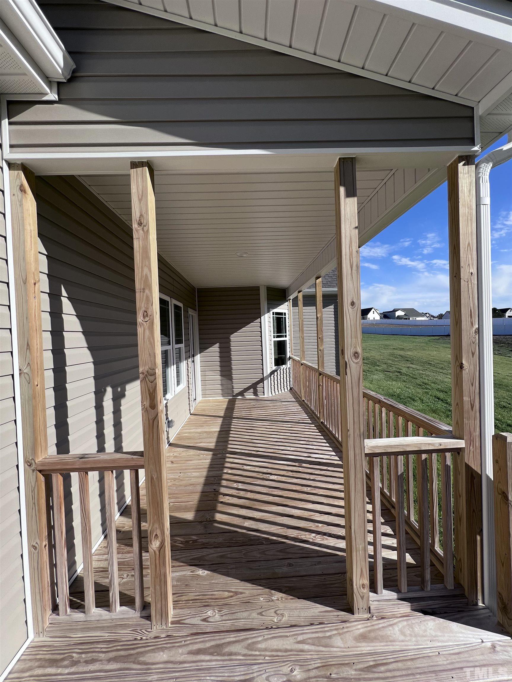 59 Cricket Hill Way Benson, NC 27504 - Photo 25 of 28 a view of a balcony with wooden floor and floor