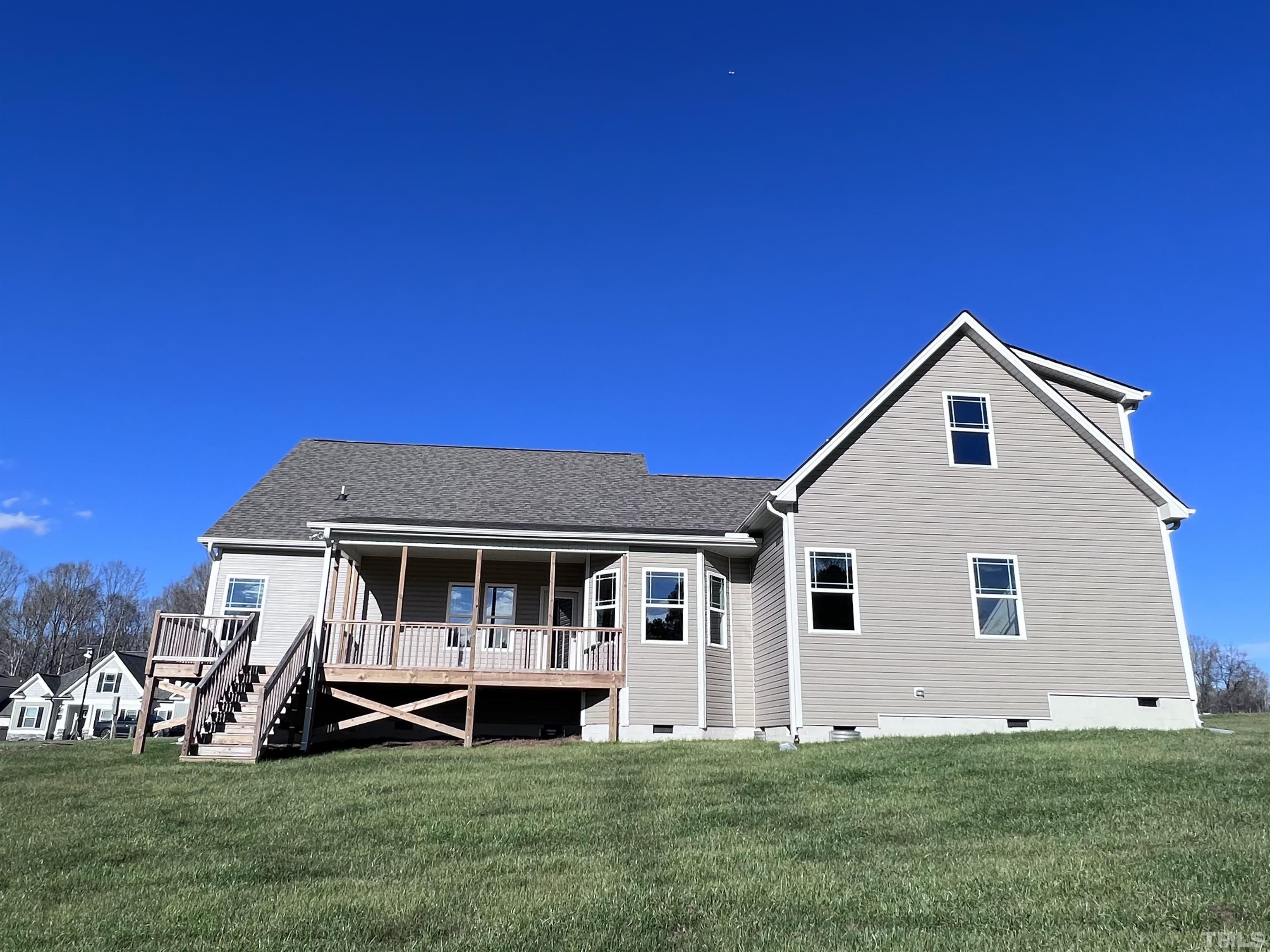 59 Cricket Hill Way Benson, NC 27504 - Photo 28 of 28 a view of a house with a yard and sitting area