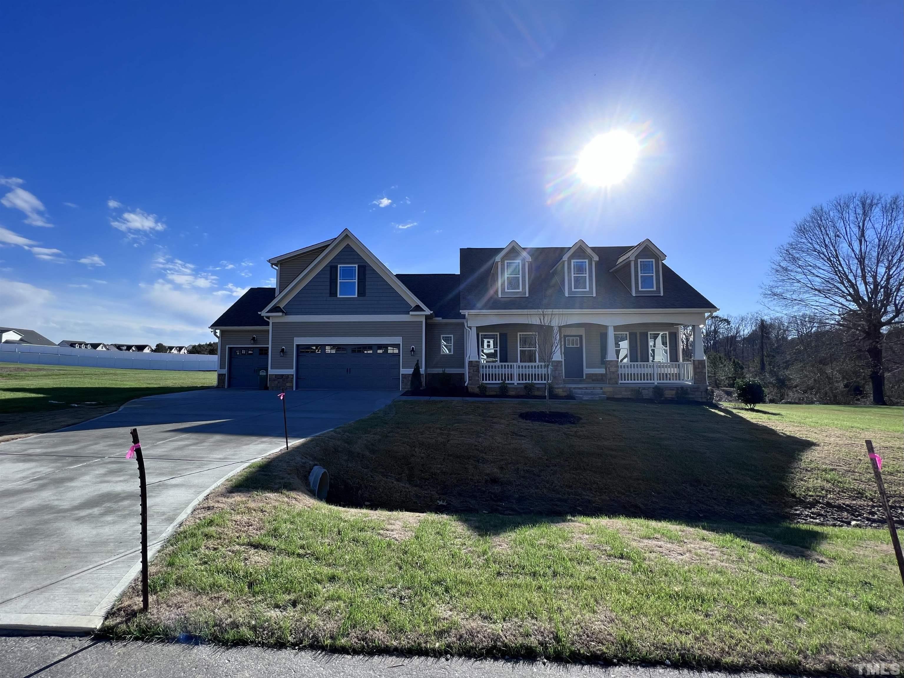59 Cricket Hill Way Benson, NC 27504 - Photo 3 of 28 a front view of a house with a yard