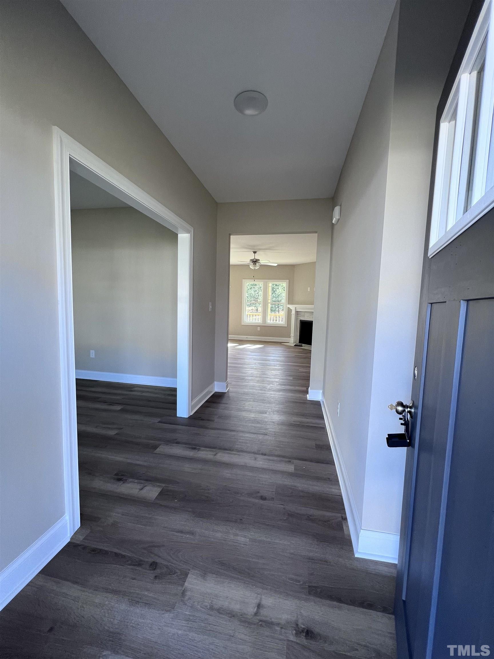 59 Cricket Hill Way Benson, NC 27504 - Photo 4 of 28 a view of a hallway with wooden floor