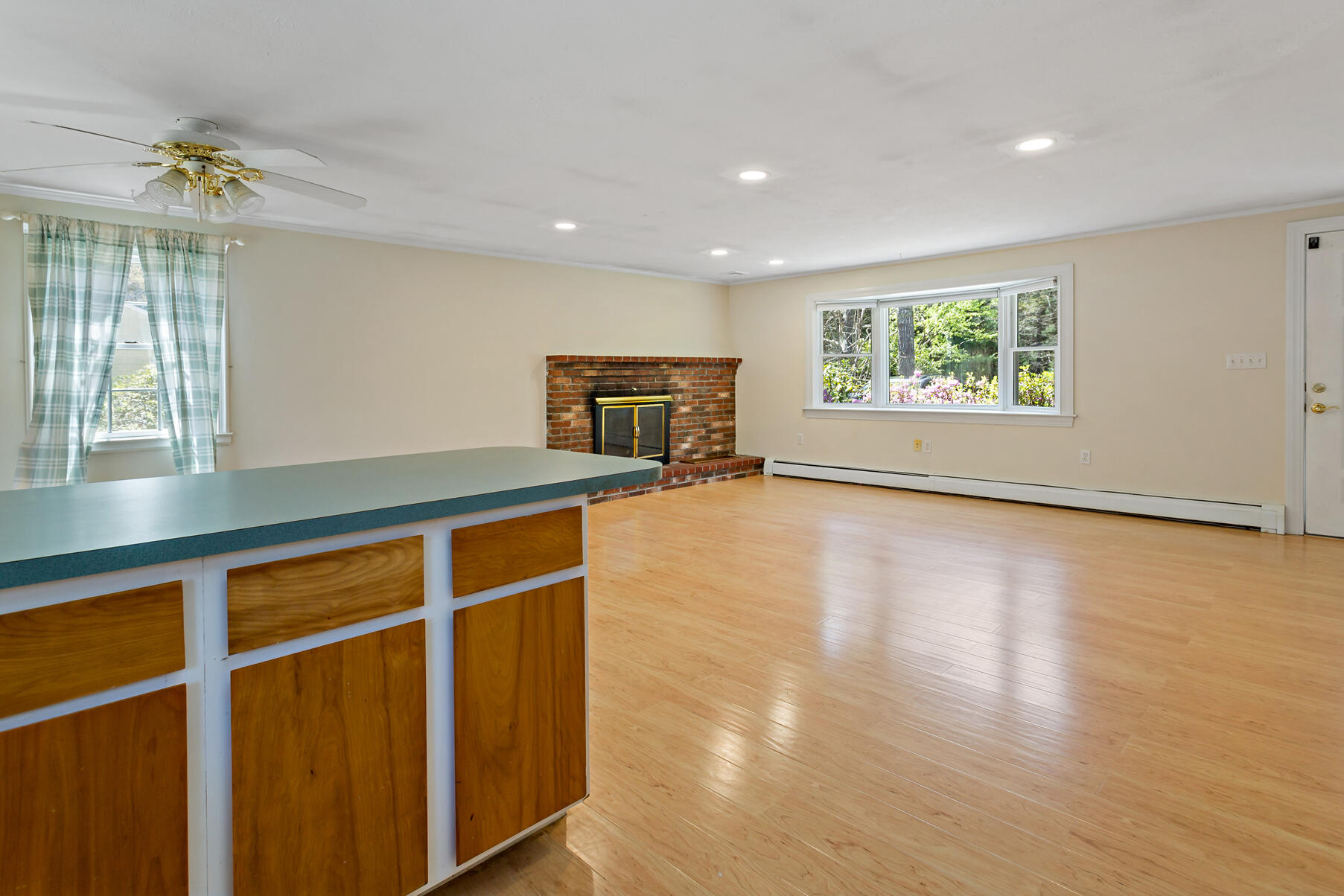 1092 Osterville West Barnstable Road Barnstable, MA 02648 - Photo 13 of 25 a view of an empty room with a window and wooden floor