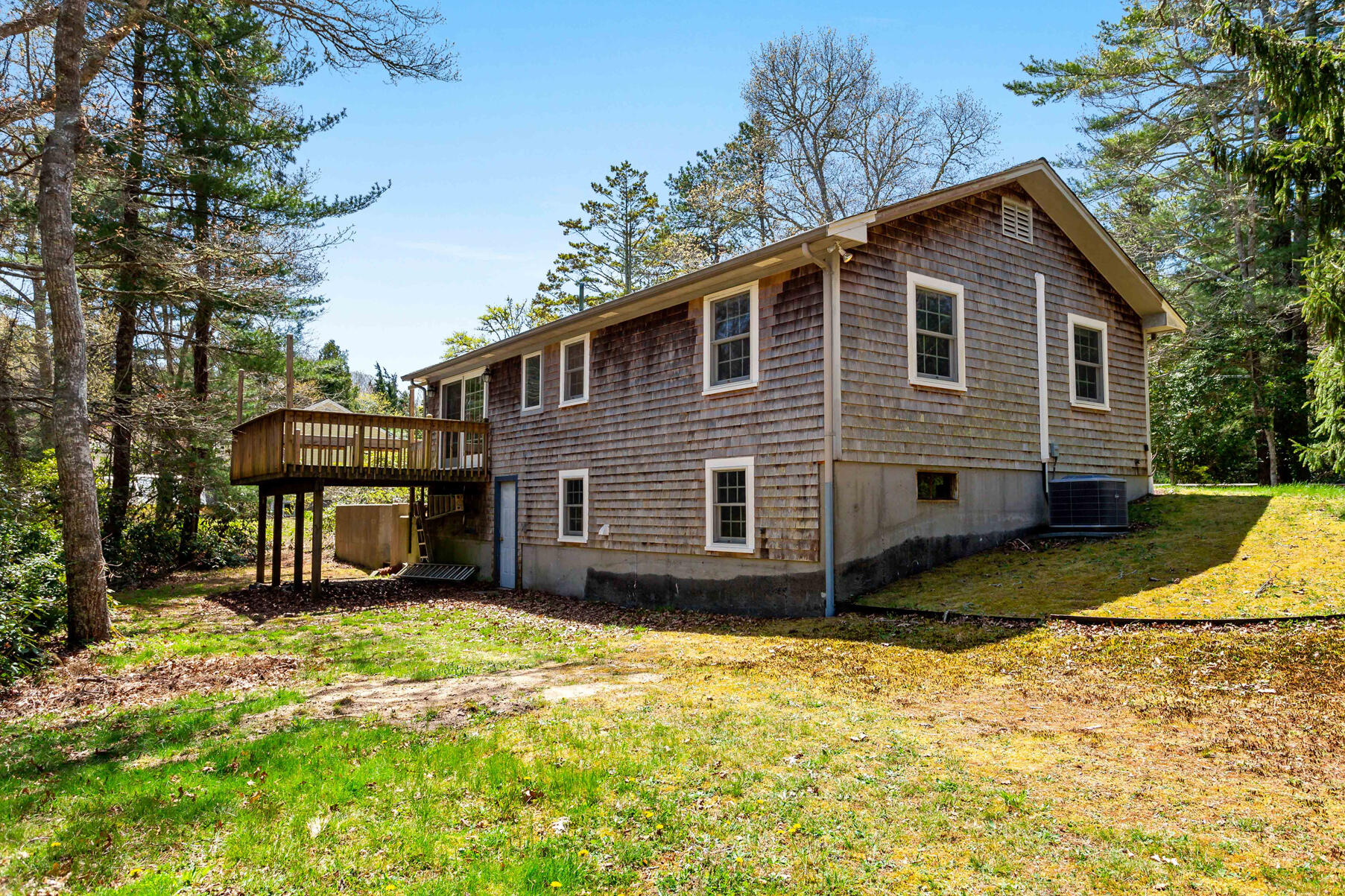 1092 Osterville West Barnstable Road Barnstable, MA 02648 - Photo 20 of 25 a front view of a house with a yard