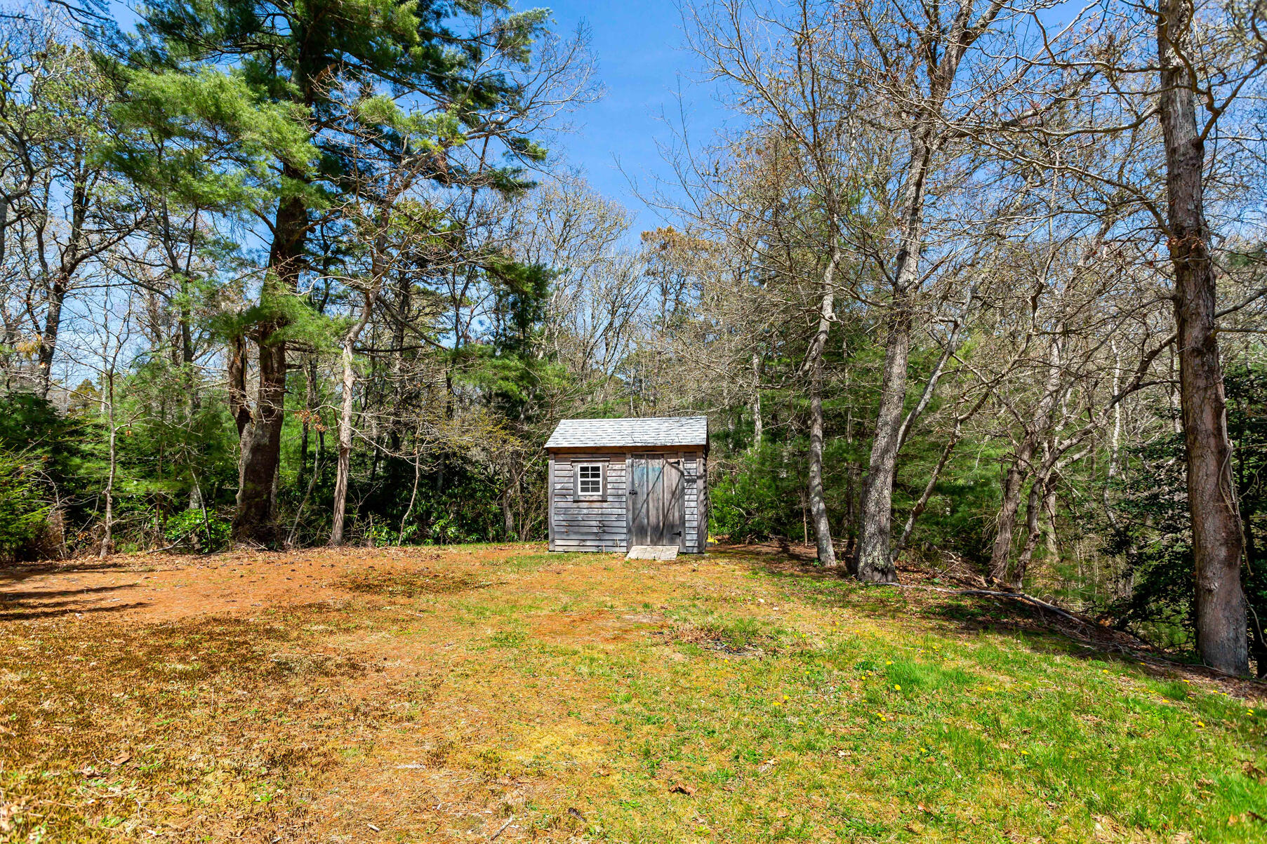 1092 Osterville West Barnstable Road Barnstable, MA 02648 - Photo 23 of 25 a view of a house with a yard