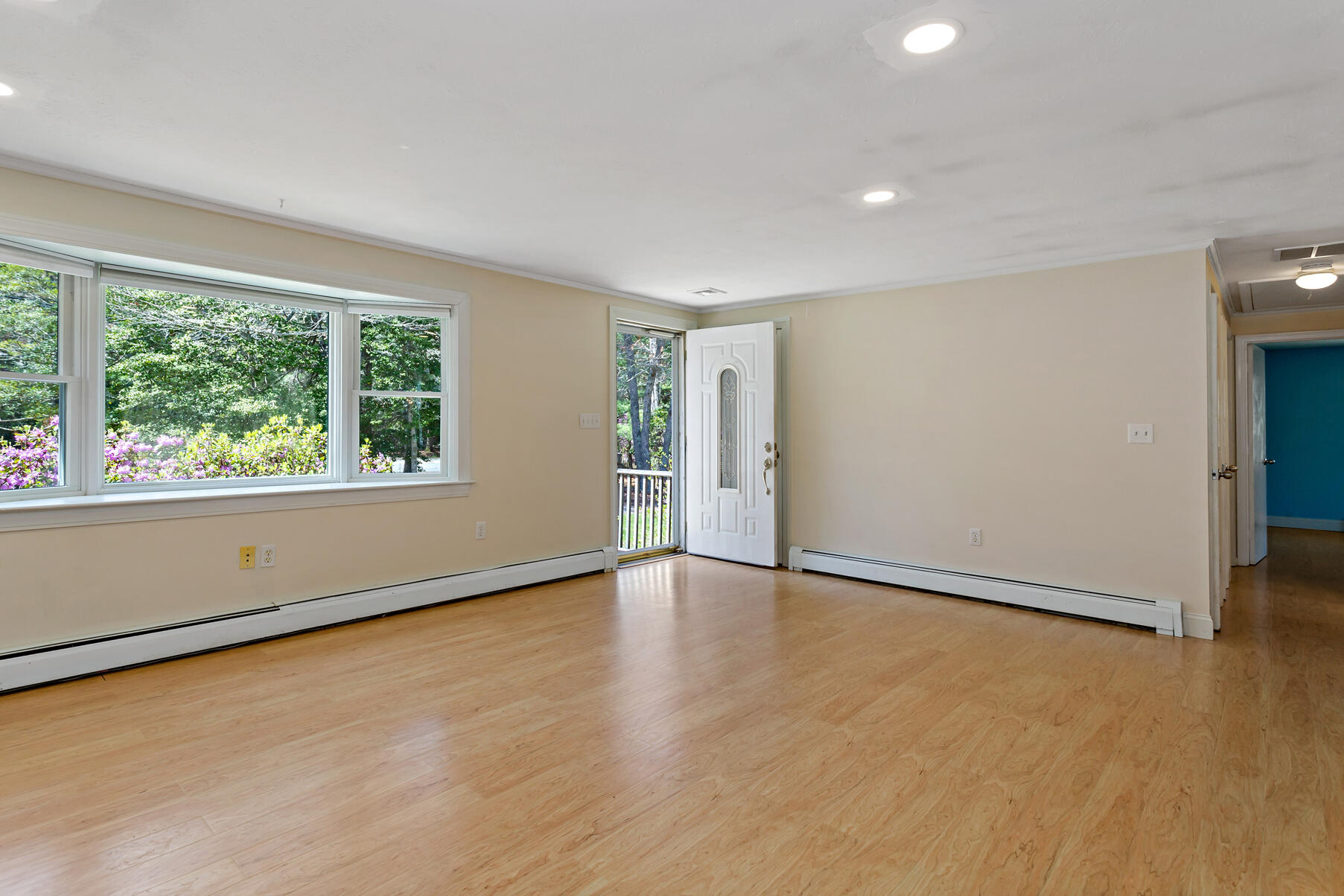1092 Osterville West Barnstable Road Barnstable, MA 02648 - Photo 3 of 25 an empty room with wooden floor and windows