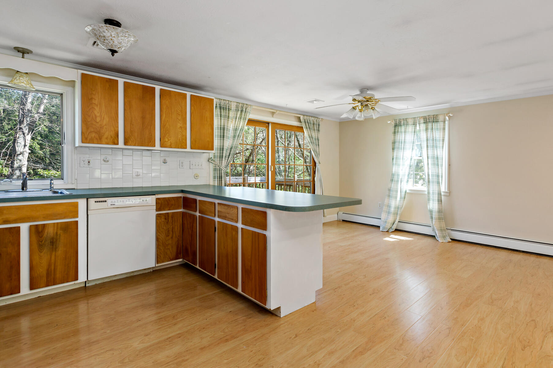 1092 Osterville West Barnstable Road Barnstable, MA 02648 - Photo 10 of 25 a kitchen with stainless steel appliances granite countertop a stove and a sink