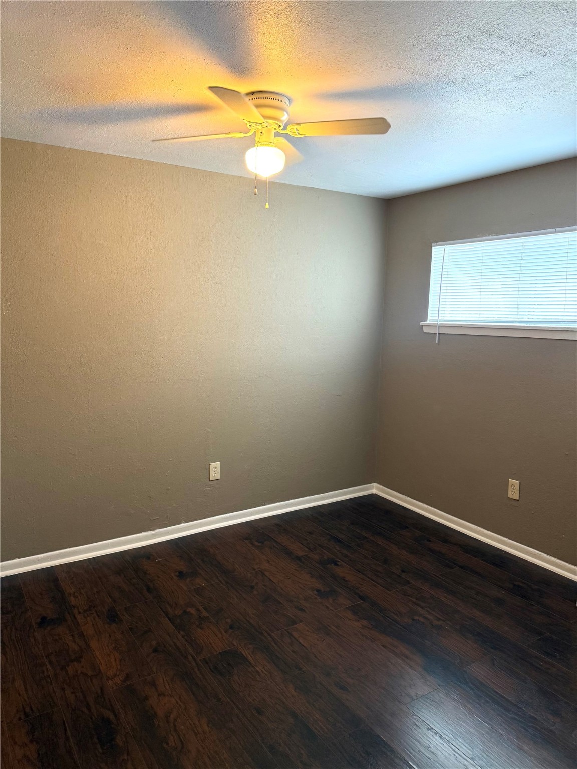 5412 Market Street, Unit 3 Houston, TX 77020 - Photo 6 of 11 a view of an empty room with wooden floor and a window