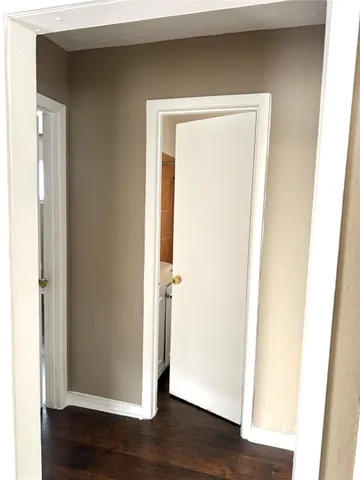a view of front door with wooden floor