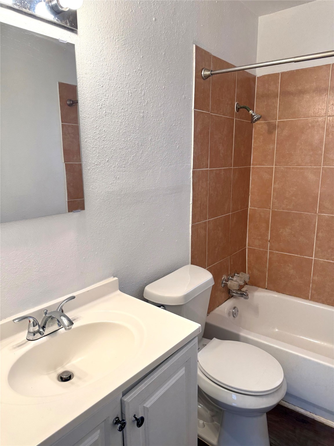 5412 Market Street, Unit 3 Houston, TX 77020 - Photo 9 of 11 a bathroom with a sink a toilet and shower