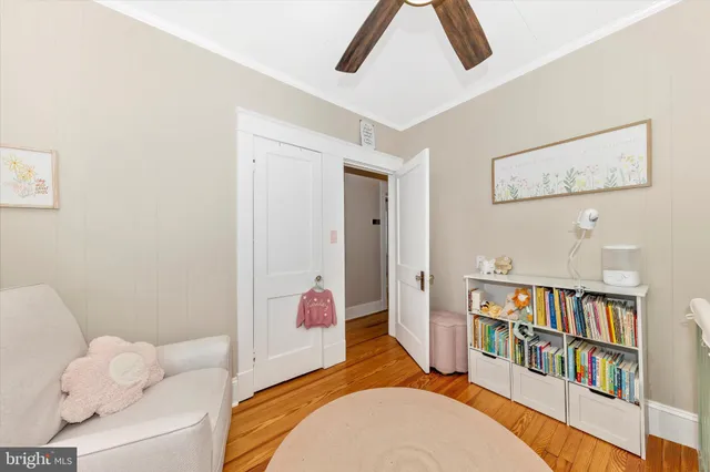 a bedroom with a bed and a book shelf