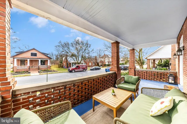 a view of balcony with couch and wooden floor