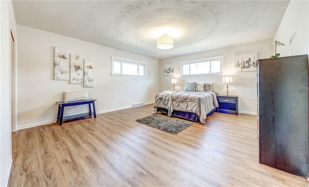 101 Lorish Road, Unit A McKees Rocks, PA 15136 - Photo 14 of 25 a spacious bedroom with a bed and a couch