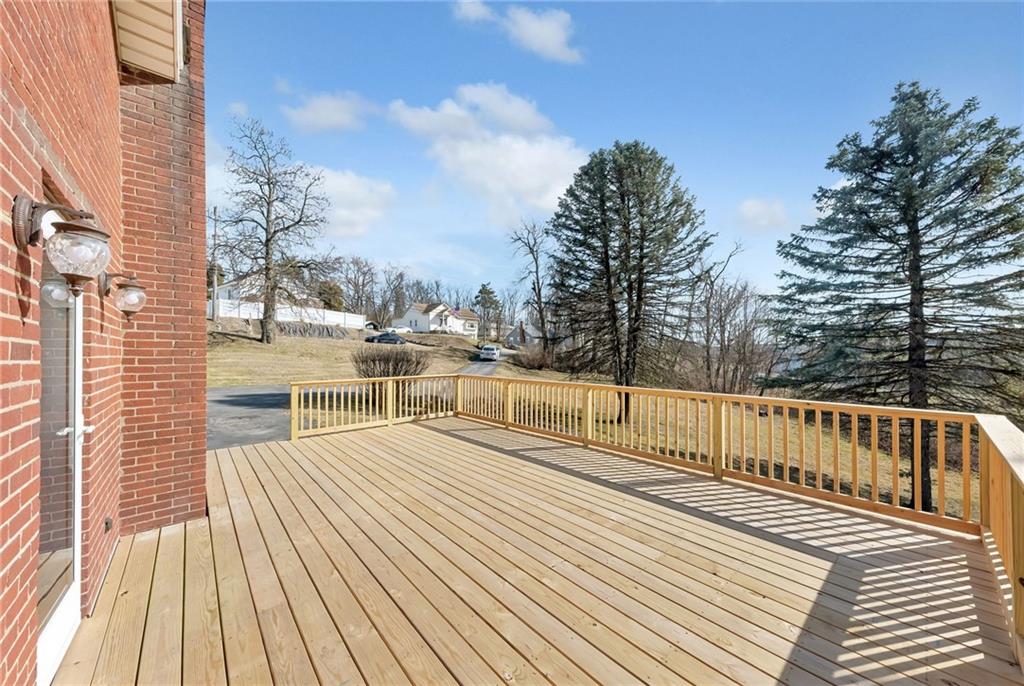 101 Lorish Road, Unit A McKees Rocks, PA 15136 - Photo 21 of 25 a view of a balcony with wooden floor and outdoor seating