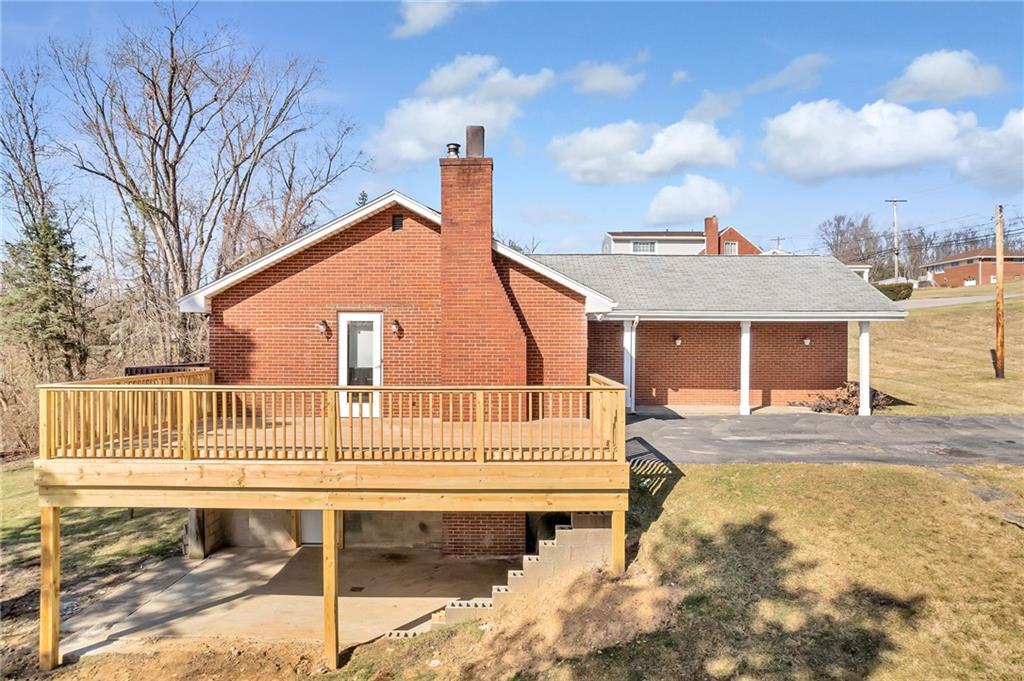 101 Lorish Road, Unit A McKees Rocks, PA 15136 - Photo 3 of 25 a view of a house with a patio and a yard