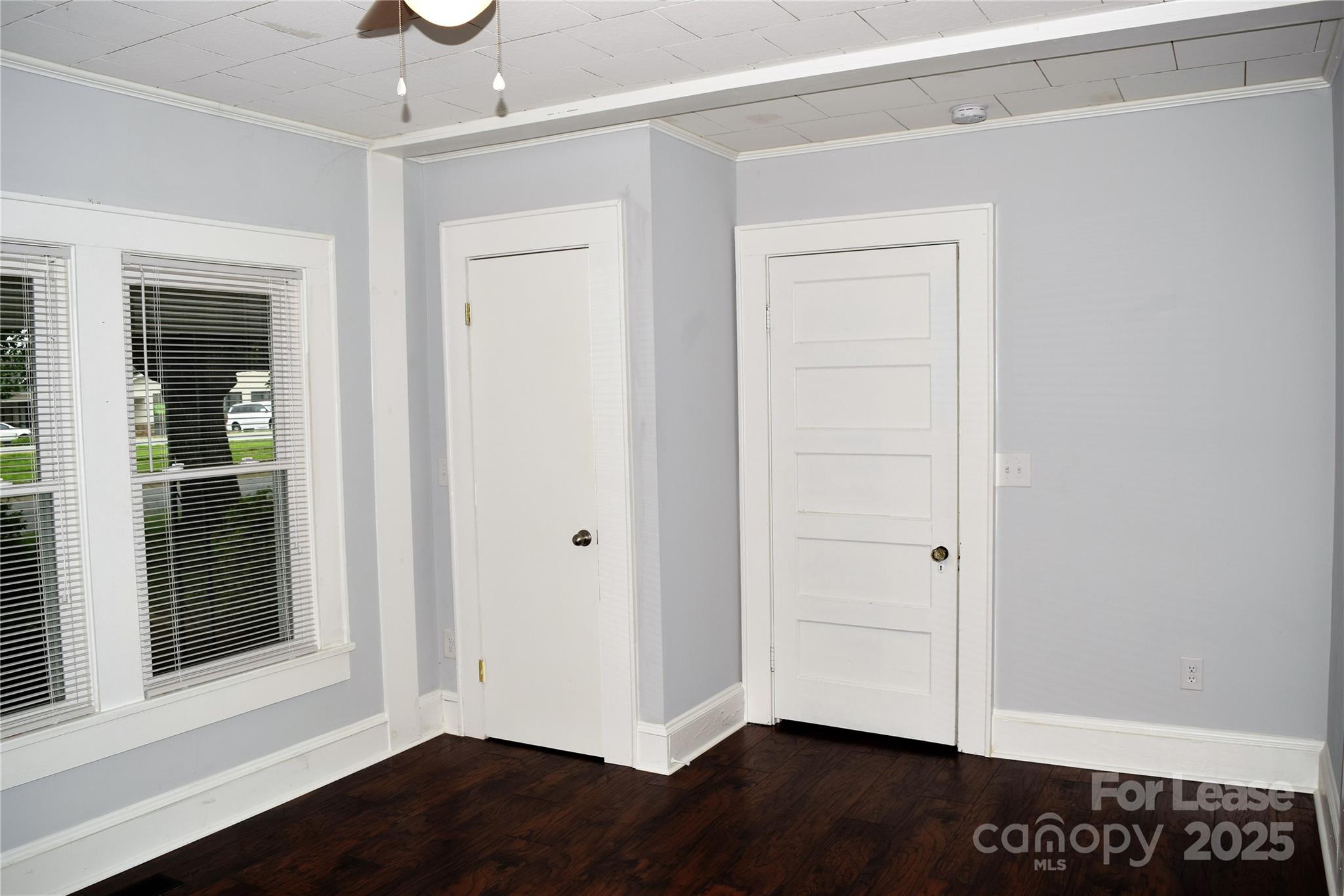 234 North Eastway Drive Troutman, NC 28166 - Photo 12 of 37 a view of empty room with wooden floor