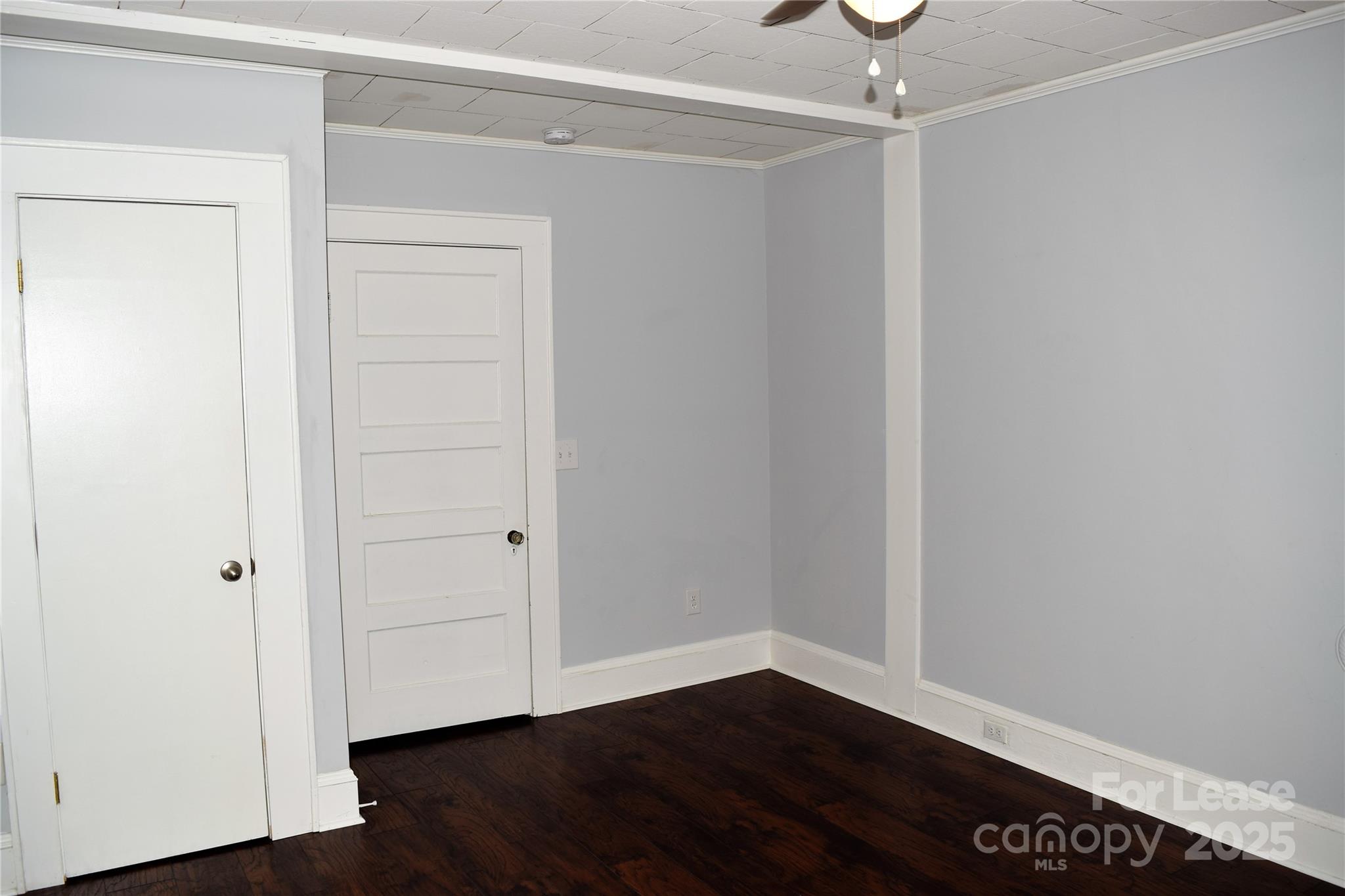 234 North Eastway Drive Troutman, NC 28166 - Photo 13 of 37 a view of an empty room with wooden floor