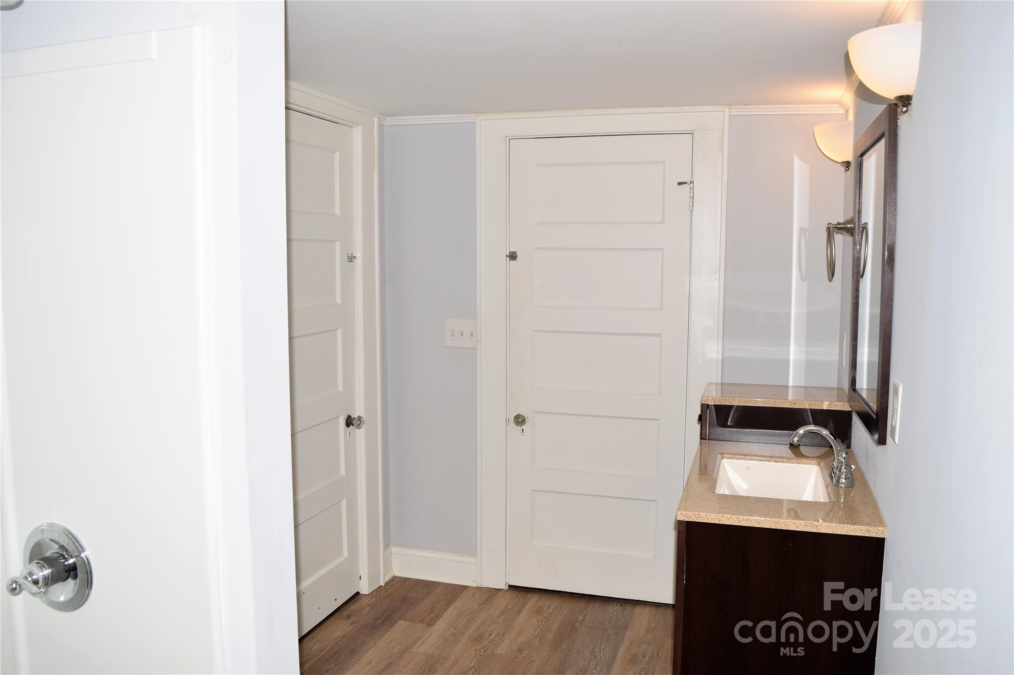 234 North Eastway Drive Troutman, NC 28166 - Photo 21 of 37 a view of front door with wooden floor