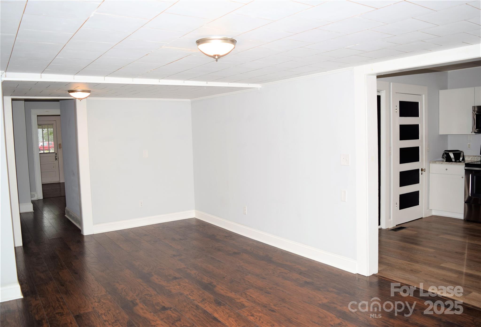 234 North Eastway Drive Troutman, NC 28166 - Photo 27 of 37 a view of an empty room with wooden floor and closet
