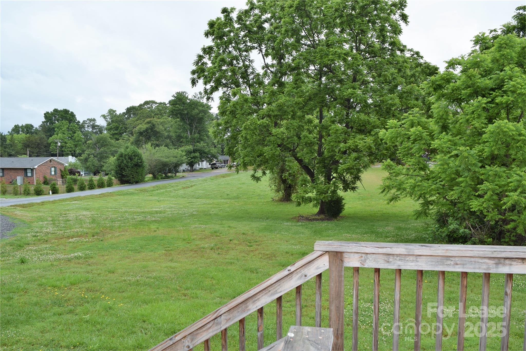 234 North Eastway Drive Troutman, NC 28166 - Photo 35 of 37 a view of a deck with a big yard