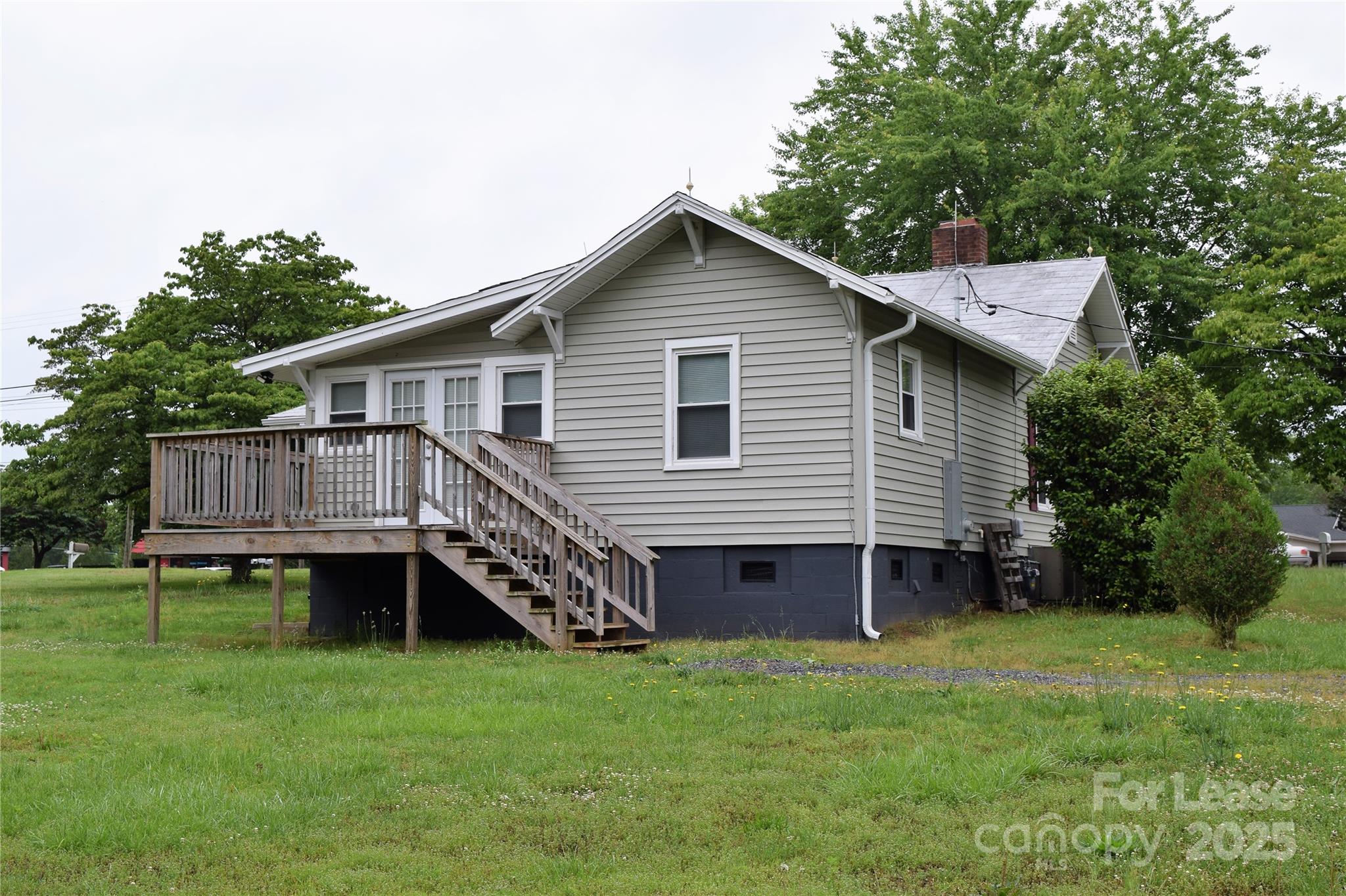 234 North Eastway Drive Troutman, NC 28166 - Photo 37 of 37 a view of a house with a backyard and deck