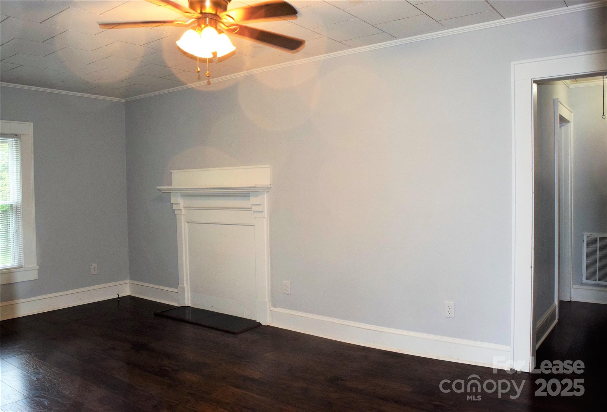 234 North Eastway Drive Troutman, NC 28166 - Photo 4 of 37 wooden floor in an empty room with a window