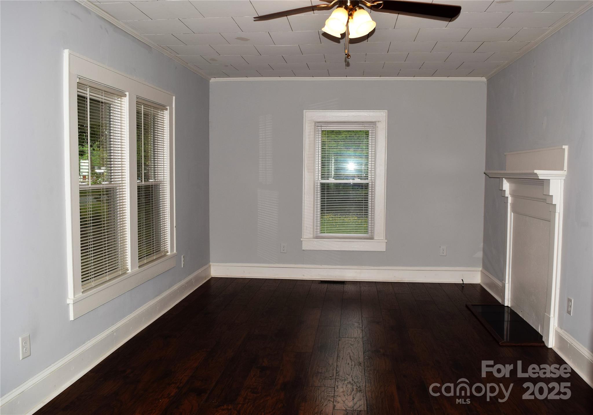 234 North Eastway Drive Troutman, NC 28166 - Photo 5 of 37 a view of an empty room with wooden floor and a window