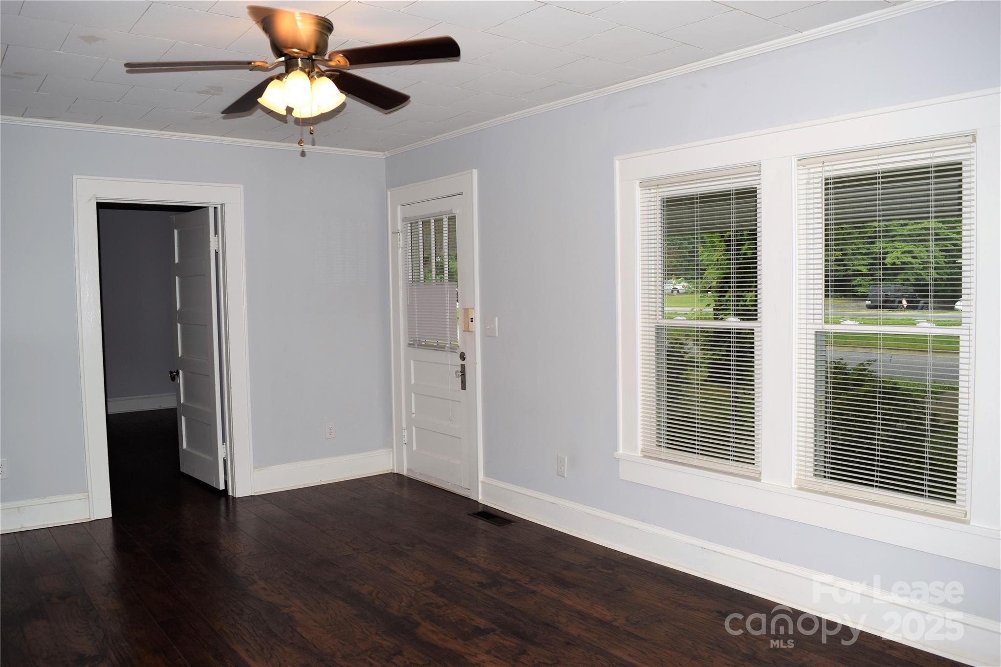 234 North Eastway Drive Troutman, NC 28166 - Photo 9 of 37 a view of an empty room with wooden floor and a window
