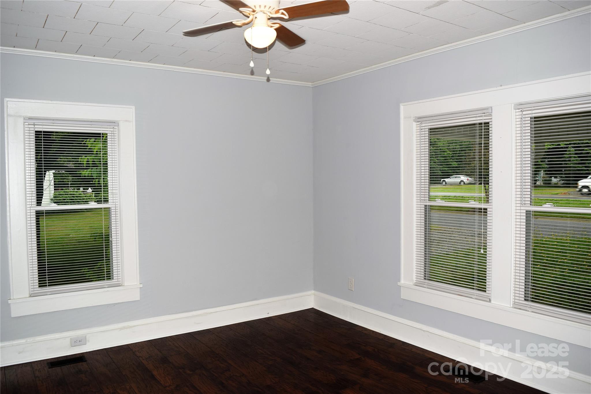 234 North Eastway Drive Troutman, NC 28166 - Photo 10 of 37 a view of an empty room with wooden floor and a window