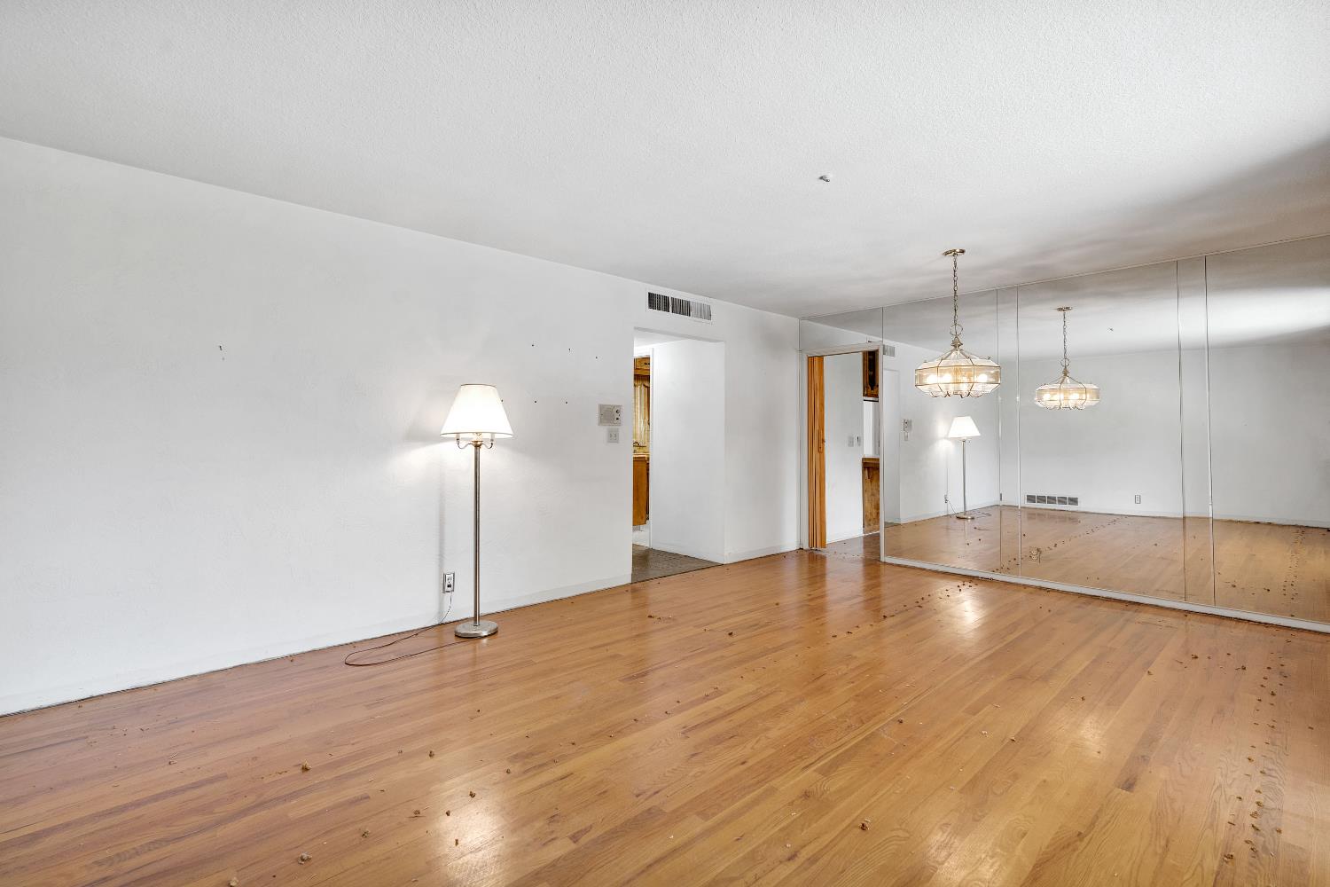 3376 East Richert Avenue Fresno, CA 93726 - Photo 16 of 29 a view of a room with wooden floor and a window