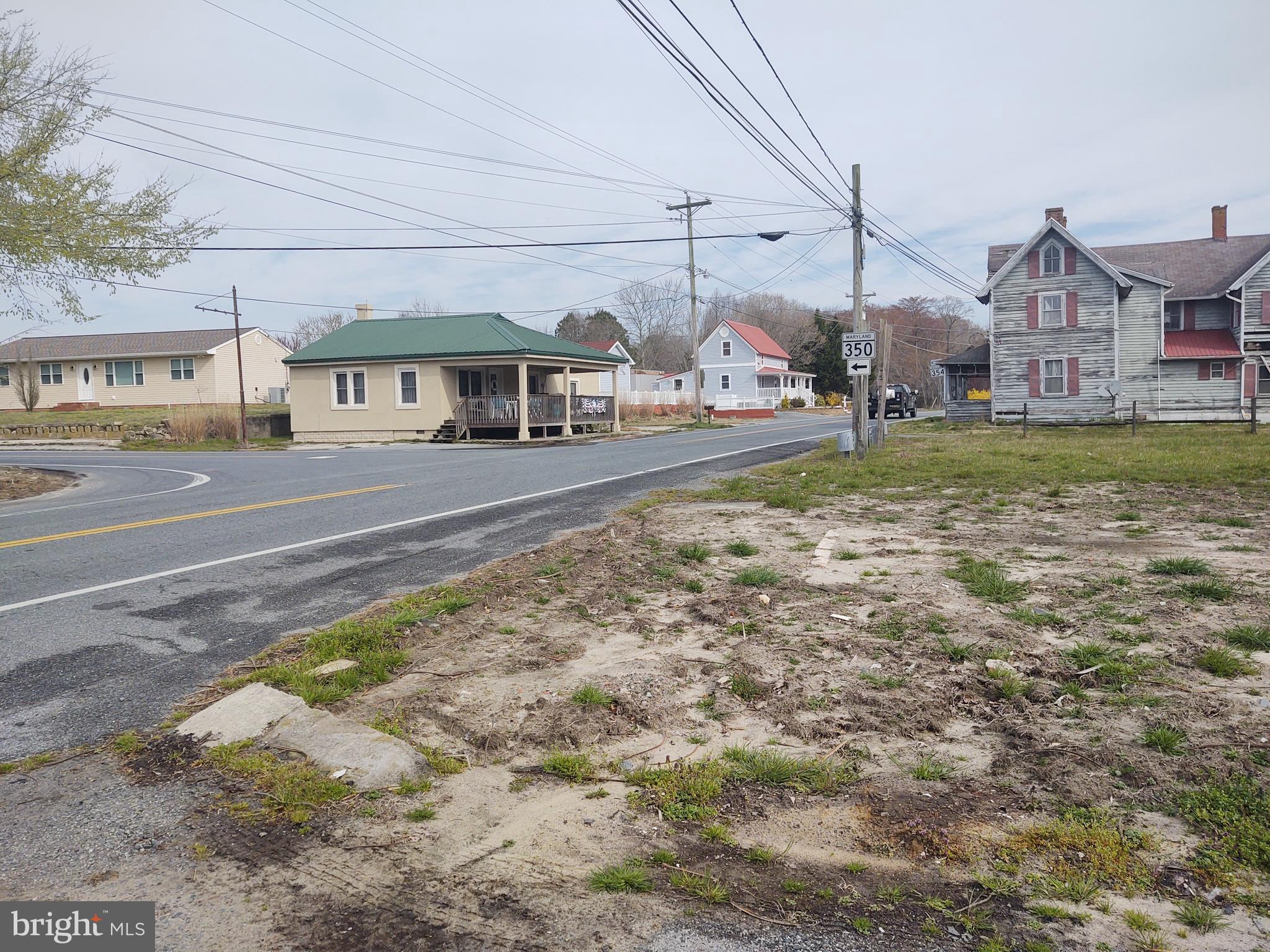5045 Powellville Road Pittsville, MD 21850 - Photo 11 of 14 a view of a large house with a big yard and large trees