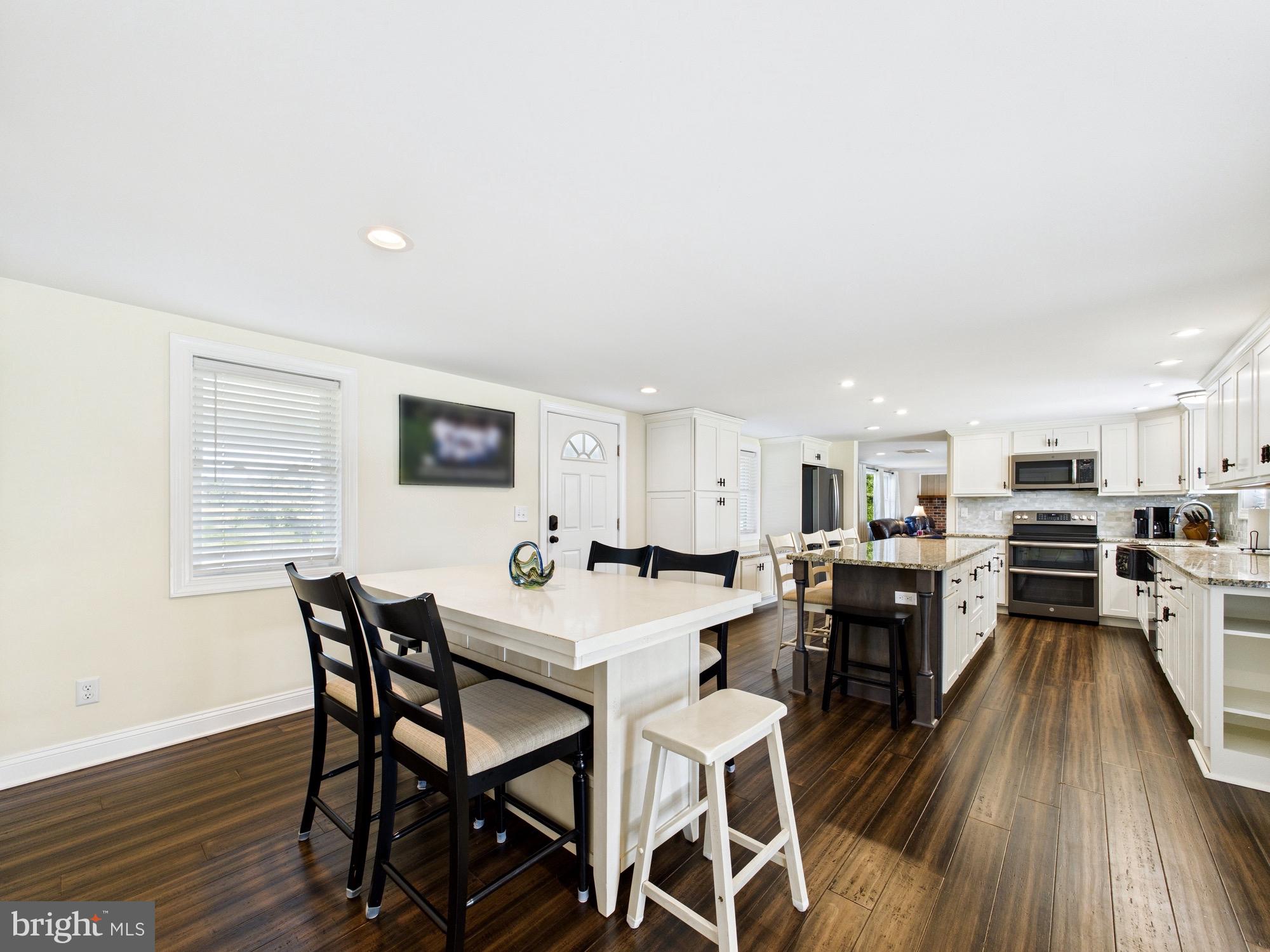 15551 Wharton Road Goldsboro, MD 21636 - Photo 11 of 80 a view of a dining room with furniture and wooden floor