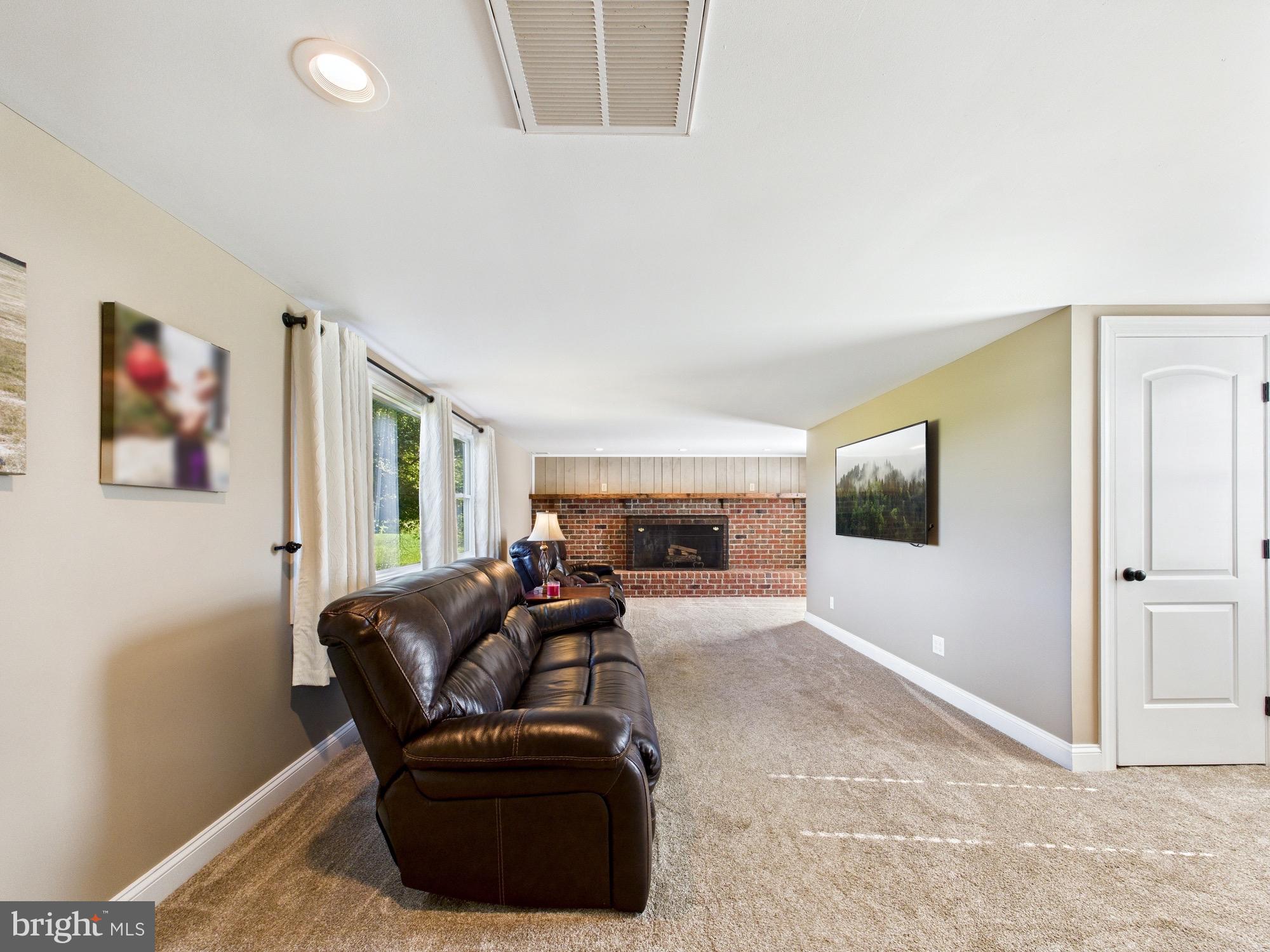 15551 Wharton Road Goldsboro, MD 21636 - Photo 22 of 80 Spacious living area with cozy fireplace.