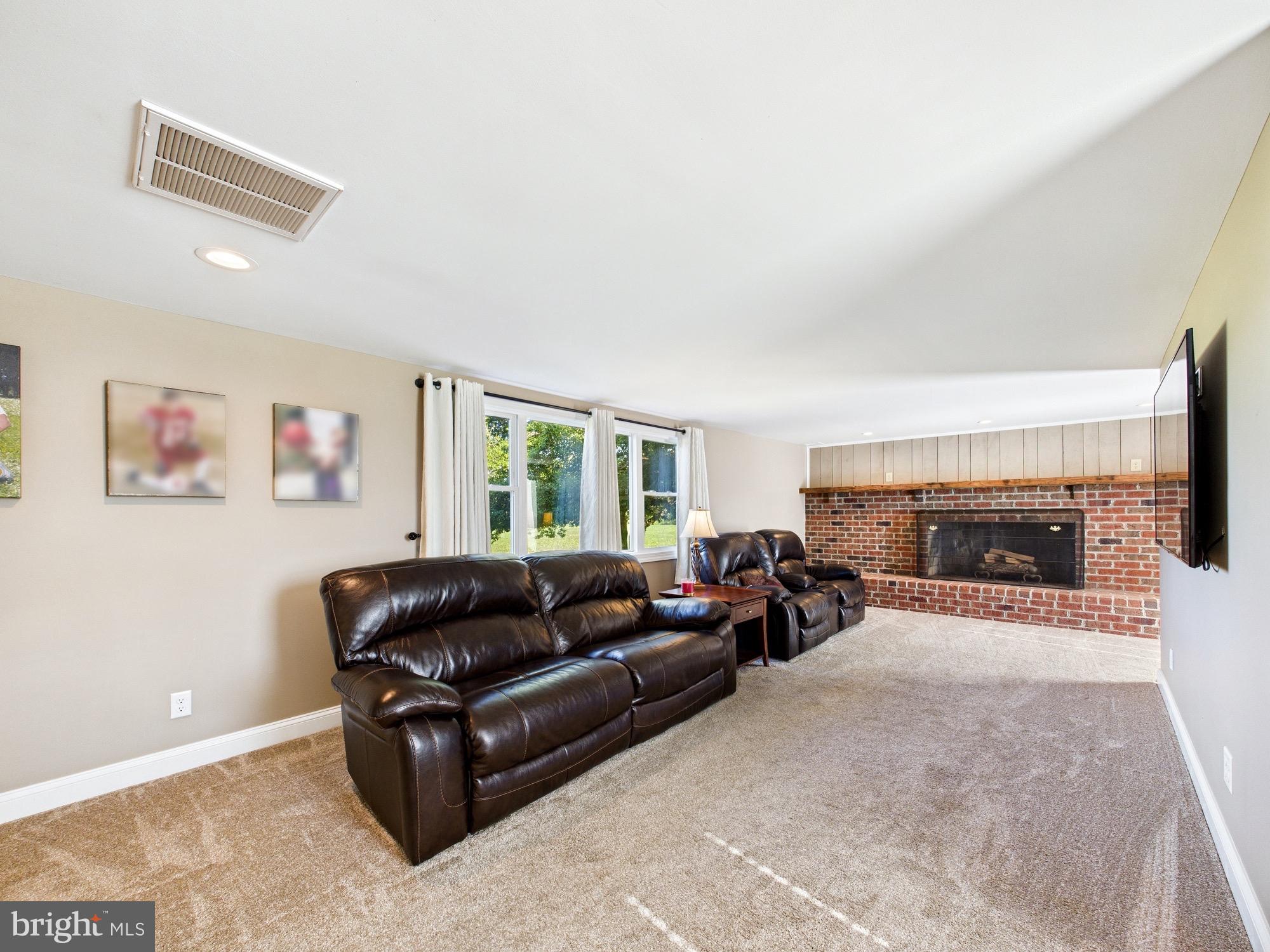 15551 Wharton Road Goldsboro, MD 21636 - Photo 23 of 80 a living room with furniture and a fireplace