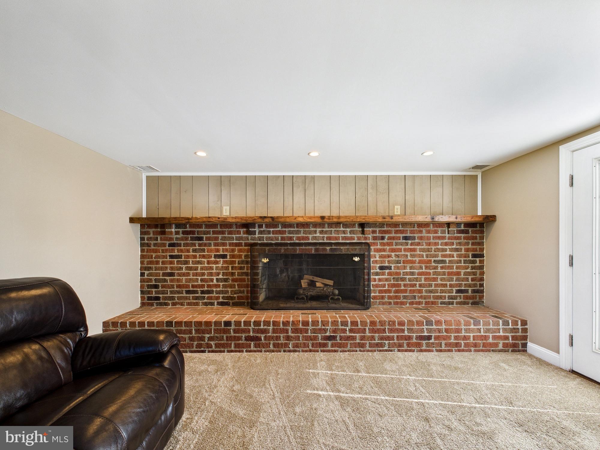 15551 Wharton Road Goldsboro, MD 21636 - Photo 24 of 80 Cozy brick fireplace as a focal point.