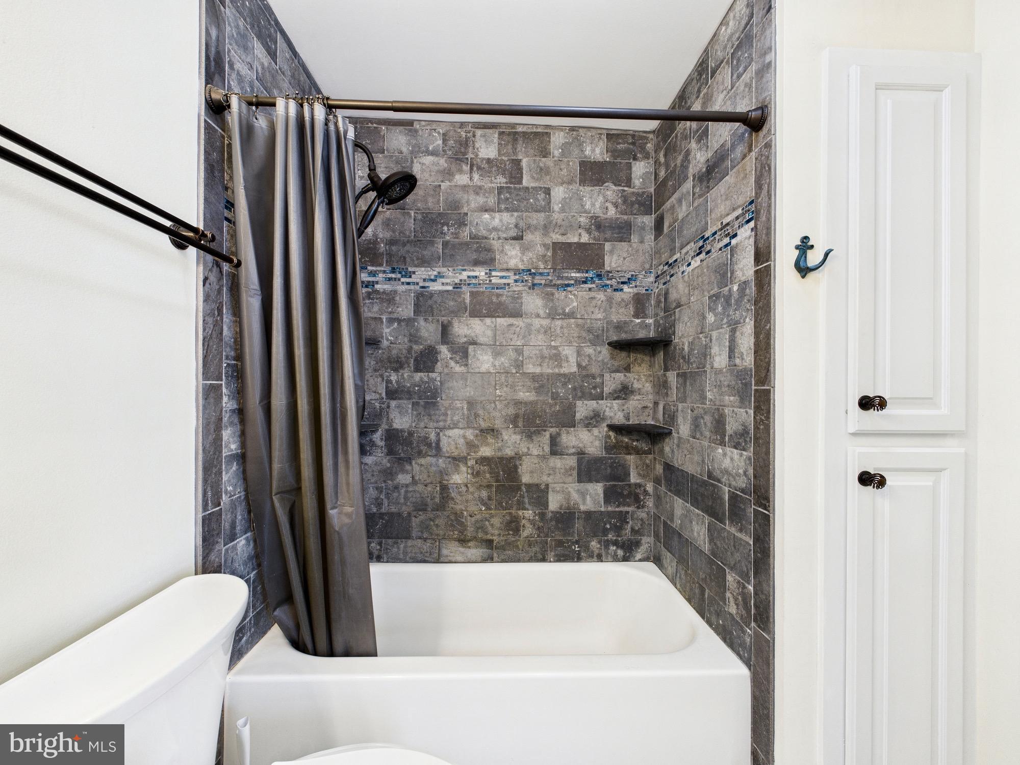 15551 Wharton Road Goldsboro, MD 21636 - Photo 34 of 80 Sleek modern bathroom with stylish tiles.