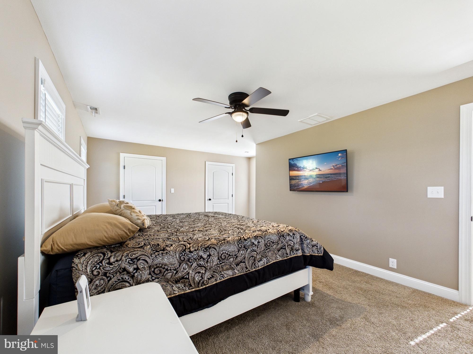 15551 Wharton Road Goldsboro, MD 21636 - Photo 35 of 80 a bedroom with a bed and ceiling fan