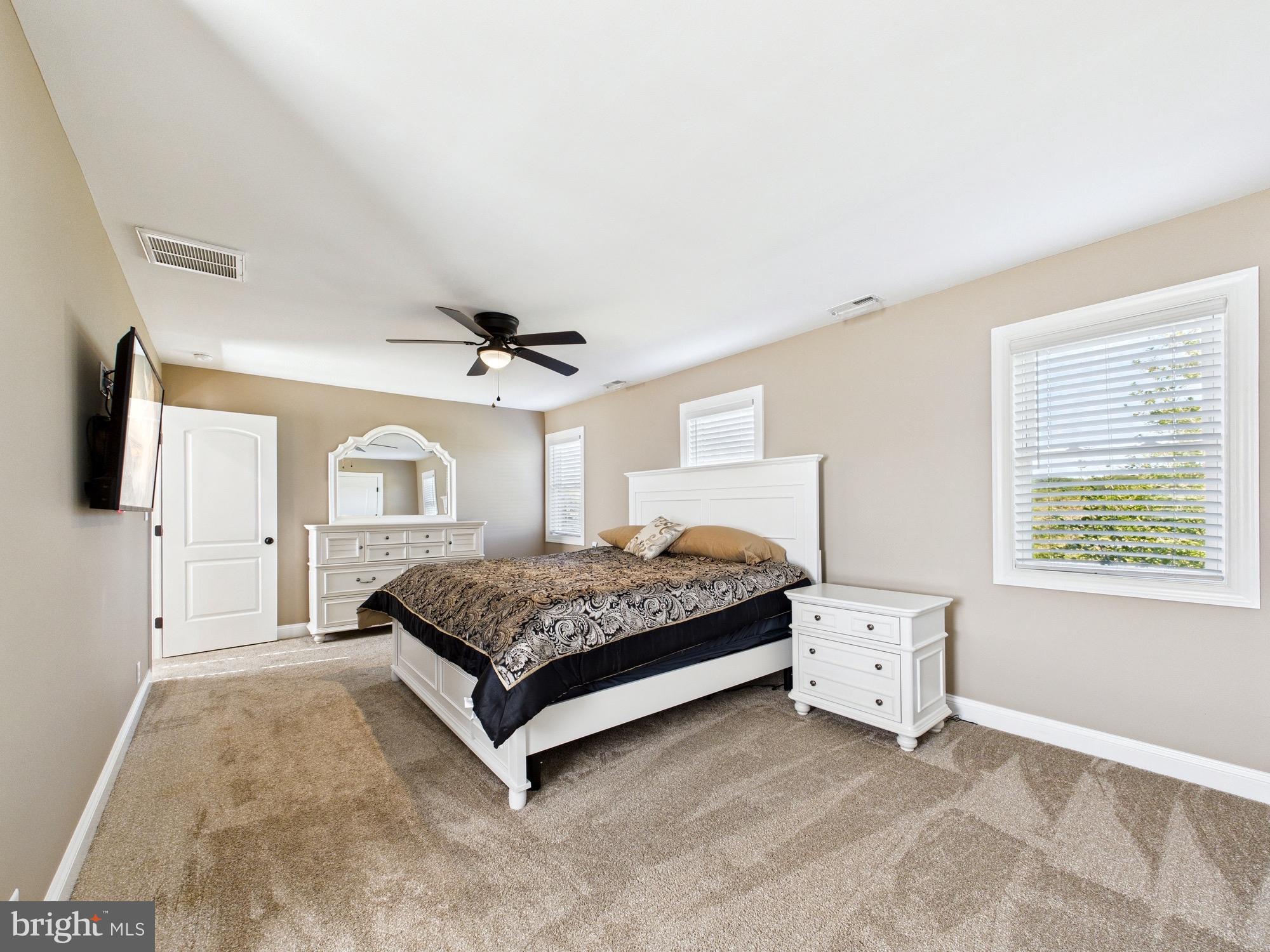 15551 Wharton Road Goldsboro, MD 21636 - Photo 36 of 80 a spacious bedroom with a bed and a window