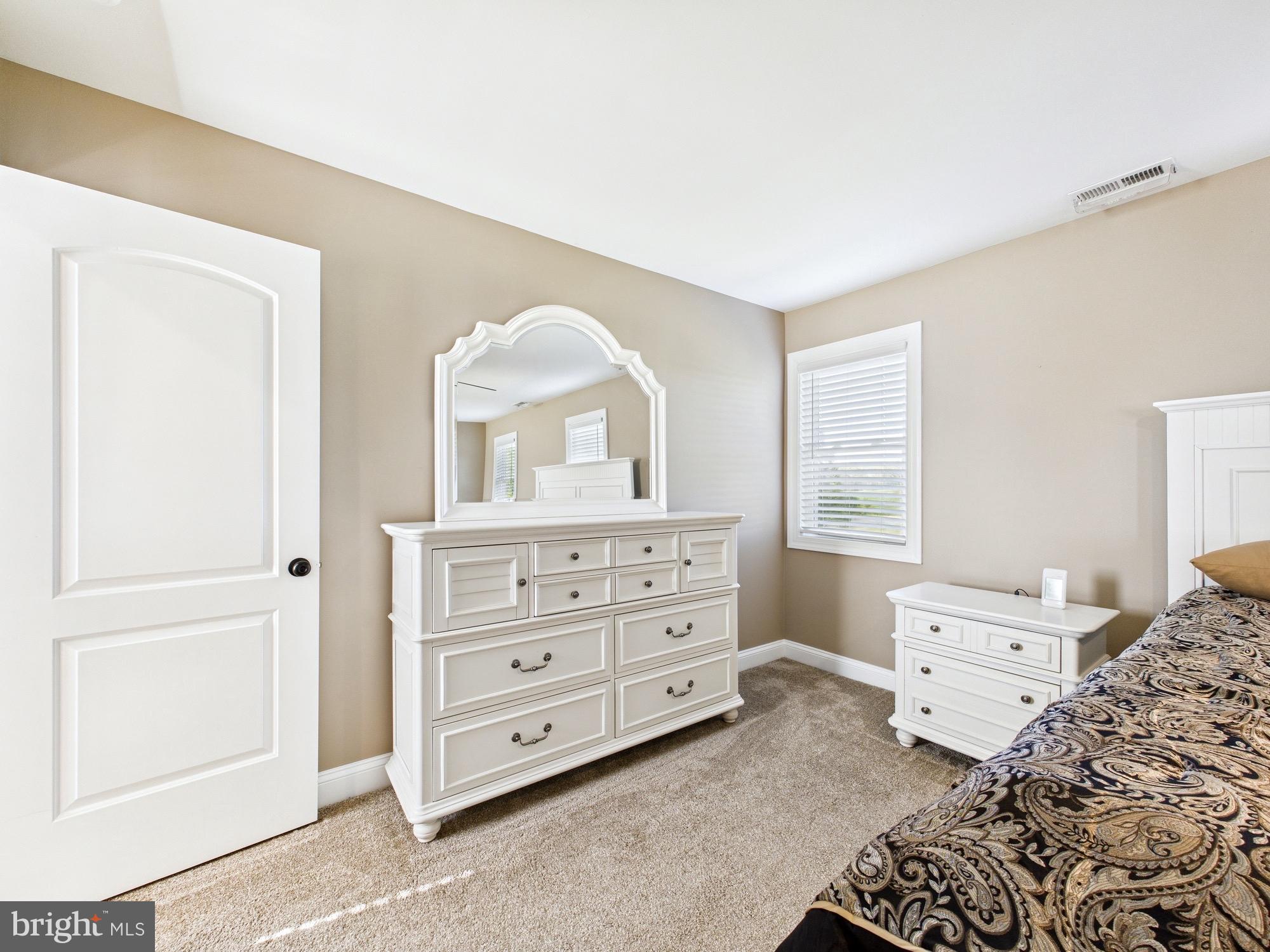 15551 Wharton Road Goldsboro, MD 21636 - Photo 37 of 80 a bedroom with a bed and a dresser in it