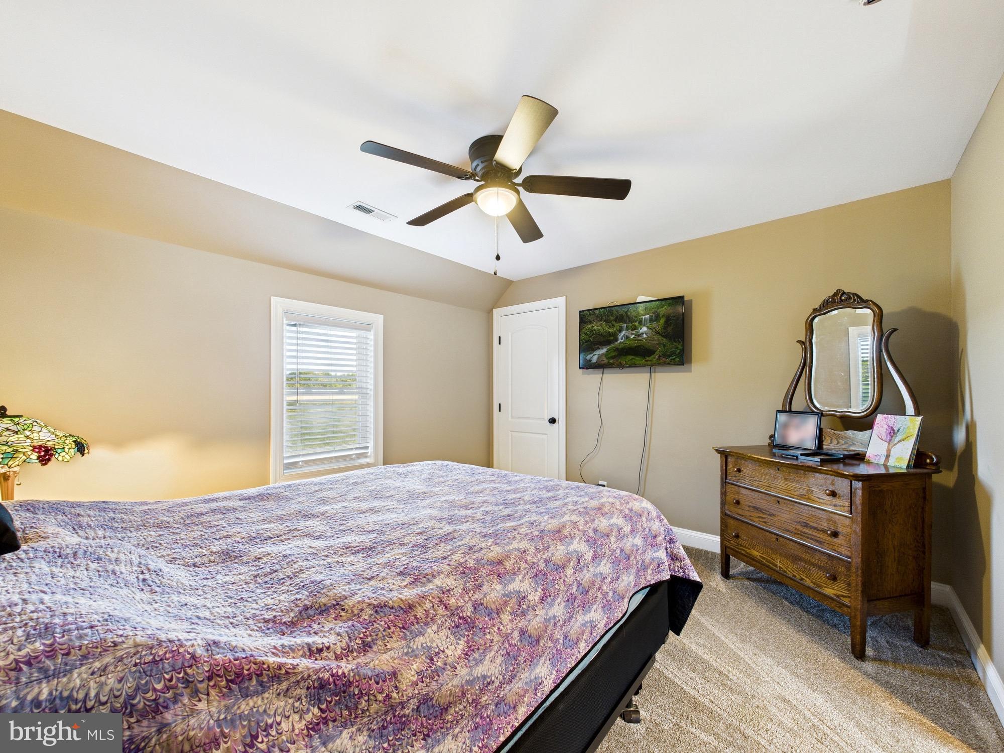 15551 Wharton Road Goldsboro, MD 21636 - Photo 42 of 80 a bedroom with a bed dresser and a window