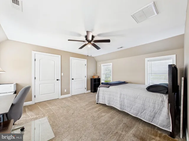 a view of a roof deck with table and chairs a barbeque with wooden floor and fence