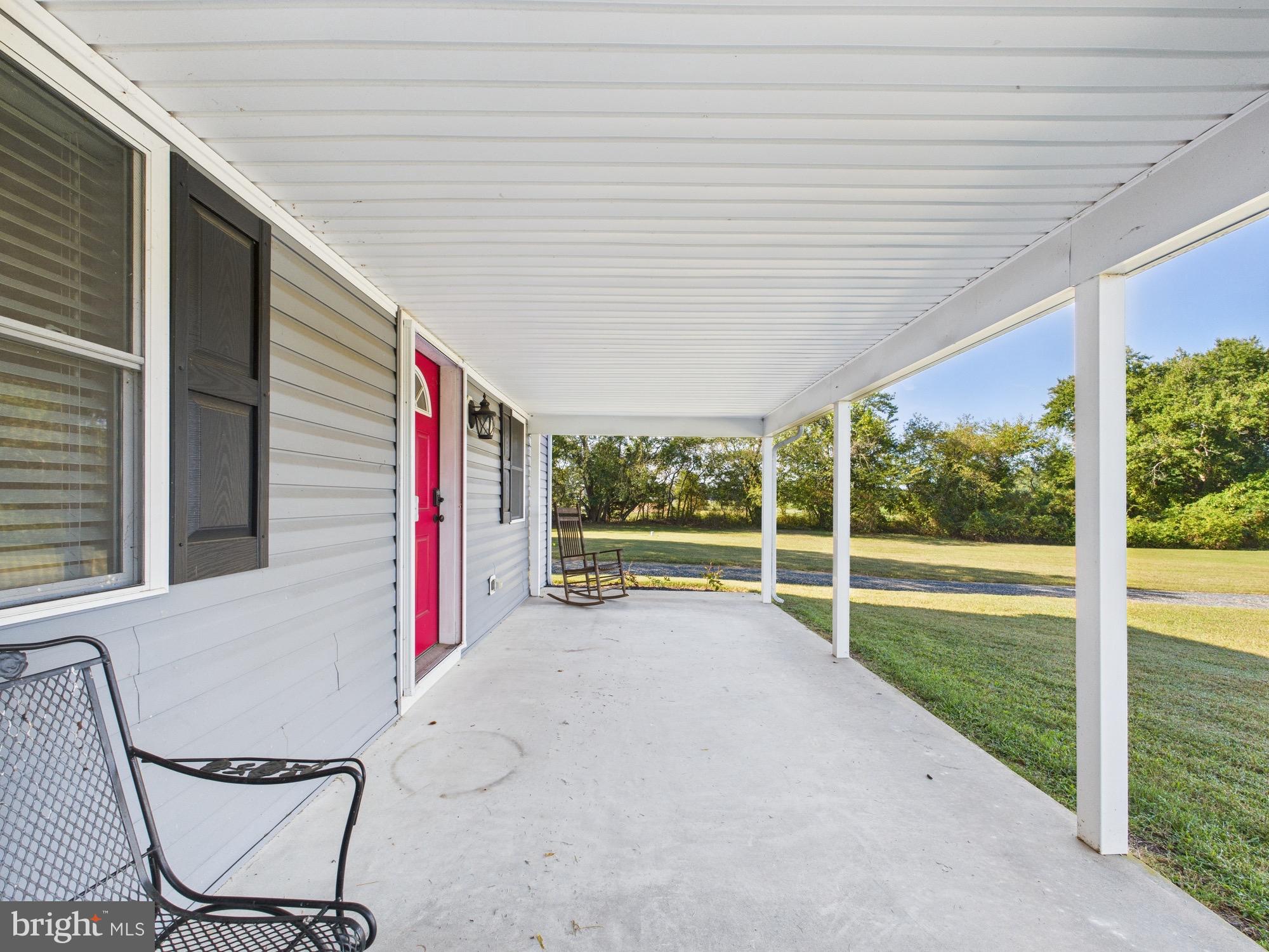 15551 Wharton Road Goldsboro, MD 21636 - Photo 62 of 80 a view of a porch with wooden floor and fence